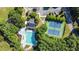 Aerial view of a community pool, tennis courts, and mature trees at 339 Mount Royall Dr, Mount Pleasant, SC 29464