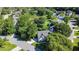 Aerial view of a neighborhood with lush greenery and a serene pond at 339 Mount Royall Dr, Mount Pleasant, SC 29464