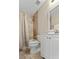 Well-lit bathroom featuring a shower with decorative curtain and neutral tile at 339 Mount Royall Dr, Mount Pleasant, SC 29464