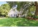 Charming single-Gathering home with a lush green lawn and mature trees providing shade at 339 Mount Royall Dr, Mount Pleasant, SC 29464