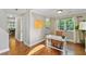 Hallway leads to home office with hardwood floors, natural light, and view to kitchen and dining area at 339 Mount Royall Dr, Mount Pleasant, SC 29464