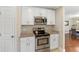Kitchen area with stainless steel oven and microwave, white cabinets, and granite countertops at 339 Mount Royall Dr, Mount Pleasant, SC 29464
