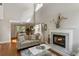 Cozy living room with fireplace, hardwood floors, and windows offering plenty of natural light at 339 Mount Royall Dr, Mount Pleasant, SC 29464