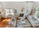 Open-concept living room with vaulted ceiling, fireplace, hardwood floors, and stylish decor at 339 Mount Royall Dr, Mount Pleasant, SC 29464
