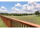 Backyard view showcasing a pond surrounded by lush green grass and trees at 364 Deep River Rd, Summerville, SC 29486