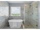 Modern bathroom with freestanding tub, glass shower, and stylish tile work at 364 Deep River Rd, Summerville, SC 29486