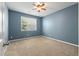 Cozy bedroom with neutral carpet, blue walls, and ample natural light at 364 Deep River Rd, Summerville, SC 29486