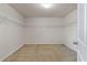 Walk-in closet featuring neutral carpet, white walls, and wire shelving at 364 Deep River Rd, Summerville, SC 29486