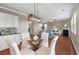Charming dining area with hardwood floors and stylish lighting at 364 Deep River Rd, Summerville, SC 29486