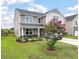 Two-story home with landscaping and flowering crape myrtle tree in the front yard at 364 Deep River Rd, Summerville, SC 29486