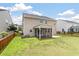 Exterior view of home with screened porch, fenced yard, and well-maintained lawn at 364 Deep River Rd, Summerville, SC 29486