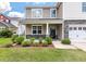 Charming home with meticulously landscaped front yard and inviting front porch at 364 Deep River Rd, Summerville, SC 29486