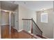 Bright hallway featuring wooden floors, a staircase and natural light at 364 Deep River Rd, Summerville, SC 29486
