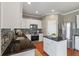 Beautiful eat-in kitchen featuring stainless appliances, granite countertops, and white cabinets at 364 Deep River Rd, Summerville, SC 29486
