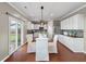 Bright kitchen featuring white cabinets, stainless appliances, and hardwood floors at 364 Deep River Rd, Summerville, SC 29486