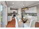 Modern eat-in kitchen featuring white cabinets and stainless appliances at 364 Deep River Rd, Summerville, SC 29486