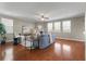 Comfortable living room with a fireplace, ceiling fan, and bright windows at 364 Deep River Rd, Summerville, SC 29486