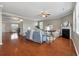 Inviting living room with a fireplace, ceiling fan, and hardwood flooring at 364 Deep River Rd, Summerville, SC 29486