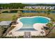 Aerial view of a community swimming pool with surrounding lounge seating and landscaping at 364 Deep River Rd, Summerville, SC 29486