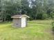 Brick storage shed in a well-manicured lawn surrounded by a vibrant green lawn at 379 Chestnut Rd, Walterboro, SC 29488