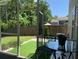 Backyard featuring a covered patio with table and chairs, an artificial turf area and a wood fence at 3808 Tupelo Branch Row, Mount Pleasant, SC 29429