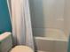 This bathroom includes a shower/tub combo with tile surround and a white shower curtain at 3808 Tupelo Branch Row, Mount Pleasant, SC 29429