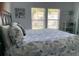 Comfortable bedroom with a large bed, bright windows, and nautical-themed décor at 3808 Tupelo Branch Row, Mount Pleasant, SC 29429