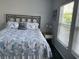 Bedroom with a comfortable bed, bright windows, and coastal-themed décor at 3808 Tupelo Branch Row, Mount Pleasant, SC 29429