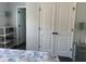 Bedroom featuring a closet and views into an adjacent bathroom at 3808 Tupelo Branch Row, Mount Pleasant, SC 29429