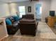 Comfortable living room with leather couches and a ceiling fan at 3808 Tupelo Branch Row, Mount Pleasant, SC 29429