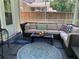Inviting screened patio with cushioned wicker furniture, a glass-top table, and a decorative fish statue at 3808 Tupelo Branch Row, Mount Pleasant, SC 29429