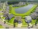 Aerial view of the real estate property showcasing the pond, landscaping, and neighborhood at 438 Flat Rock Ln, Summerville, SC 29486