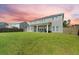 View of the back of the house and a spacious backyard, perfect for outdoor activities at 438 Flat Rock Ln, Summerville, SC 29486