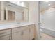 Bathroom features a vanity with framed mirror, cabinets, and a shower at 438 Flat Rock Ln, Summerville, SC 29486