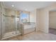 Bright bathroom features a glass shower and soaking tub near a window at 438 Flat Rock Ln, Summerville, SC 29486