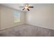 A well lit bedroom features neutral walls, carpeting, and a ceiling fan at 438 Flat Rock Ln, Summerville, SC 29486
