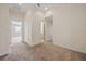 Large bonus room with neutral carpet and two doorways, offering versatile space at 438 Flat Rock Ln, Summerville, SC 29486