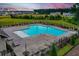 Areal view of a community pool with plenty of seating and umbrellas at 438 Flat Rock Ln, Summerville, SC 29486