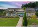 Community pool house with a pathway leading to a gated swimming pool at 438 Flat Rock Ln, Summerville, SC 29486
