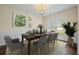 Formal dining room featuring modern decor, ample space, and a large window at 438 Flat Rock Ln, Summerville, SC 29486