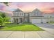 Charming two-story home featuring a manicured lawn and inviting curb appeal at 438 Flat Rock Ln, Summerville, SC 29486
