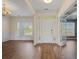 Welcoming foyer with laminate flooring, white trim, and natural light at 438 Flat Rock Ln, Summerville, SC 29486