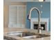 Close up of a kitchen sink with stainless steel faucet and granite countertops at 438 Flat Rock Ln, Summerville, SC 29486