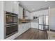Bright kitchen equipped with stainless steel appliances, granite countertops and plenty of cabinet space at 438 Flat Rock Ln, Summerville, SC 29486