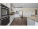 Modern kitchen featuring stainless-steel appliances, granite countertops, and ample cabinet space, perfect for cooking at 438 Flat Rock Ln, Summerville, SC 29486