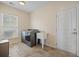Functional laundry room with a window, utility sink, washer, and dryer at 438 Flat Rock Ln, Summerville, SC 29486