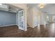 Open-concept living space with laminate floors and modern blue walls at 438 Flat Rock Ln, Summerville, SC 29486