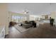 Open living room boasts lots of windows, fireplace, flowing seamlessly into the kitchen for modern living at 438 Flat Rock Ln, Summerville, SC 29486
