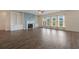 Spacious living room featuring a fireplace with built in bookshelves and hardwood floors at 438 Flat Rock Ln, Summerville, SC 29486