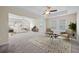 Spacious main bedroom featuring carpet, tray ceiling, ceiling fan, and furniture on display at 438 Flat Rock Ln, Summerville, SC 29486